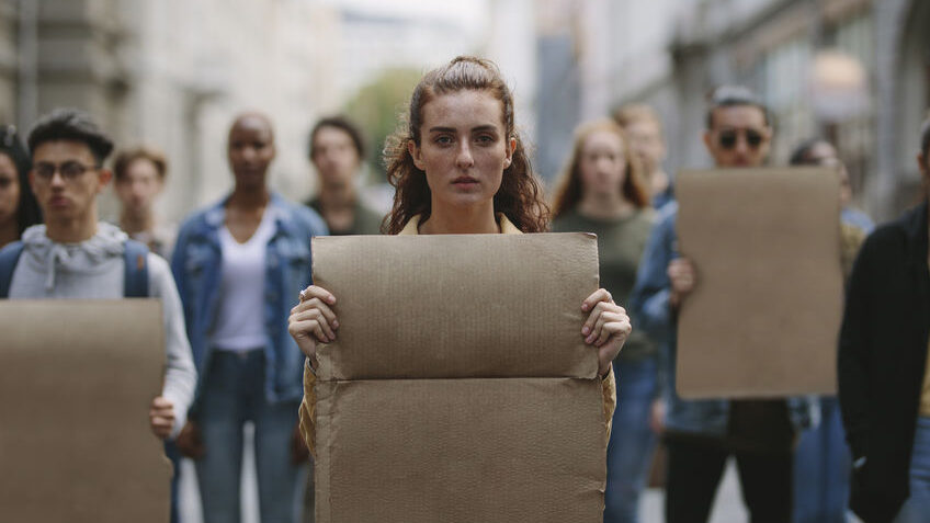 People demonstrating with blank placards